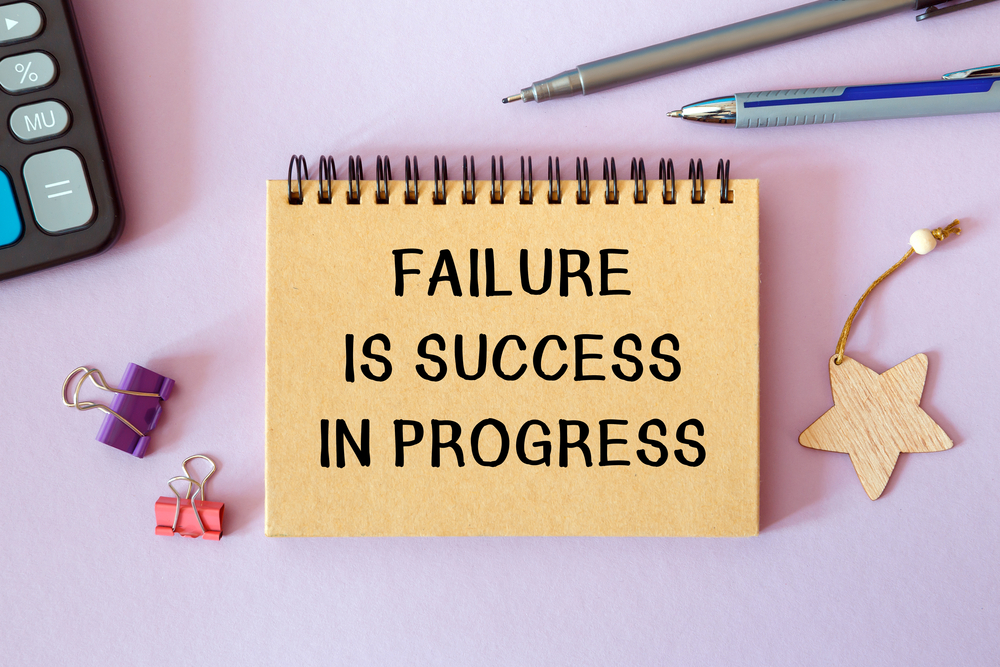 Failure is success in progress on notepad